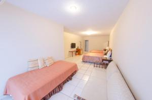 Voodi või voodid majutusasutuse Palm Tree Hotel Kenting toas