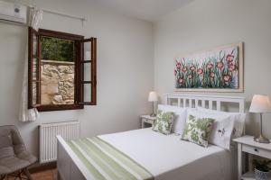 Postel nebo postele na pokoji v ubytování Koukounari luxury villa