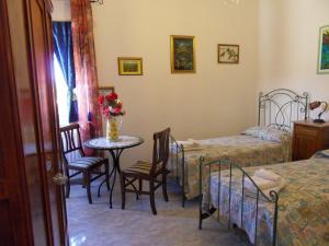 Postel nebo postele na pokoji v ubytování Di mare e di Sale