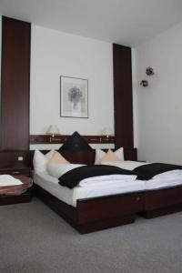 Vuode tai vuoteita majoituspaikassa Stadt-Gut-Hotels - Das Kleine Hotel