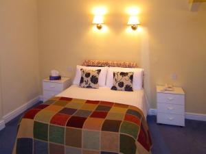 A bed or beds in a room at The North Euston Hotel 