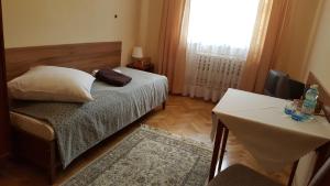 Posteľ alebo postele v izbe v ubytovaní Stary Dom Zdrojowy