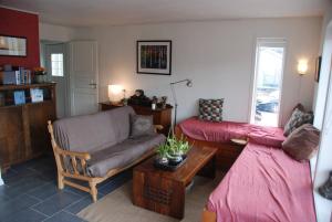 a living room with a couch and a couch and a table at Apartment - Lille Galleri - Fyresdal in Fyresdal