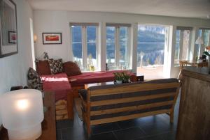 a living room with a couch and a table at Apartment - Lille Galleri - Fyresdal in Fyresdal