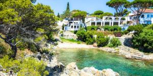 a house on a hill next to a river at Blue Ocean in Platja  d'Aro