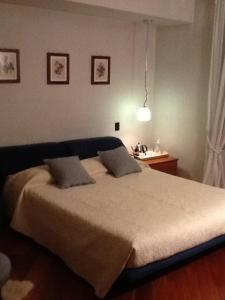 Een bed of bedden in een kamer bij B&b La corte dei Gelsomini
