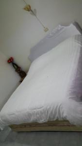 מיטה או מיטות בחדר ב-Meaungkorn Villa