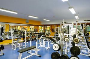 a gym with a lot of equipment in it at Evenia Zoraida Garden in Roquetas de Mar