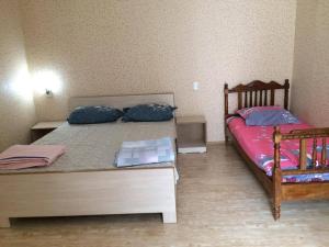 Postel nebo postele na pokoji v ubytování Guest House Econom