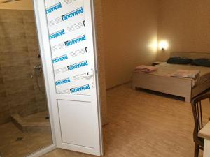 Postel nebo postele na pokoji v ubytování Guest House Econom