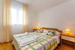 Ένα ή περισσότερα κρεβάτια σε δωμάτιο στο Villa Luka