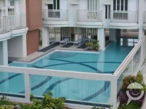 an overhead view of an apartment building with a swimming pool at AAA Condominium in Tagaytay