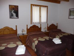 Ένα ή περισσότερα κρεβάτια σε δωμάτιο στο Casa Font de Seuri