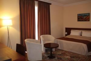 Voodi või voodid majutusasutuse Arève Résidence Boutique Hotel toas