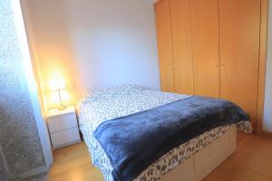 A bed or beds in a room at Bright Sao Domingos Apartments