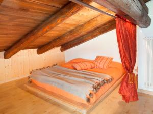 Llit o llits en una habitació de Albergo Diffuso Sauris in Sauris Di Sopra