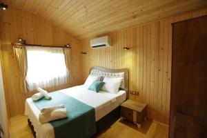 Postel nebo postele na pokoji v ubytování Leontopolis Apart Otel
