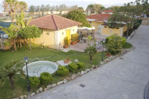 A garden outside Hotel Club Sabbiadoro