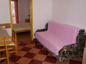 a living room with a couch and a table at Apartmani Nevena in Herceg-Novi +16 photos