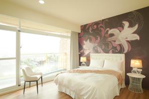 Llit o llits en una habitació de 大鵬灣瞭望台 Top Bay B&B