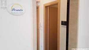 a door to a room with a sign on the wall at Case Vacanza Marzano in Monopoli
