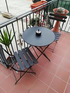a table and two chairs on a balcony at Locanda del Golfo in La Spezia