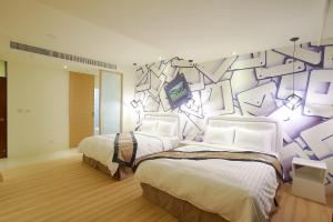 Llit o llits en una habitació de 大鵬灣瞭望台 Top Bay B&B