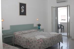 Voodi või voodid majutusasutuse Albergo 2 Pini toas