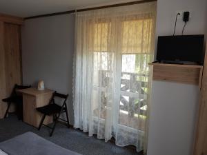 Telewizja i/lub zestaw kina domowego w obiekcie Villa Nina