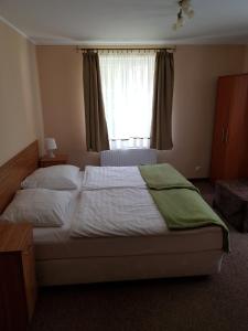 Łóżko lub łóżka w pokoju w obiekcie Villa Nina