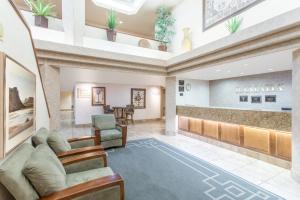 a lobby of a hotel with a waiting room at Ramada by Wyndham St George in St. George
