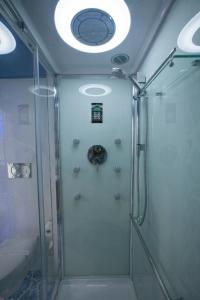 a shower with a glass door in a bathroom at Golfo Delle Sirene in Sorrento