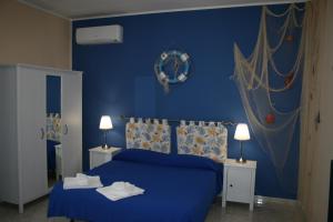 A bed or beds in a room at B&B Tifeo