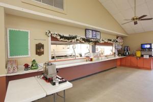 a fast food restaurant with a counter in a room at Orlando RV Resort in Orlando
