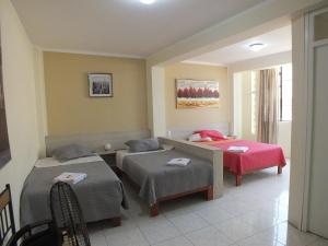 Ένα ή περισσότερα κρεβάτια σε δωμάτιο στο Hostal Gazu