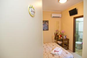 A bed or beds in a room at B&B Tifeo