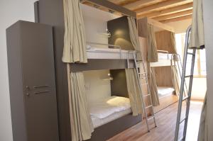 a group of bunk beds in a room at Hostel Antique in Pula
