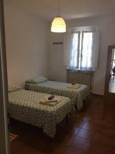 Postel nebo postele na pokoji v ubytování A Casa di Lucia