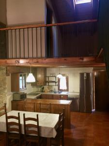 a kitchen with a table and chairs in a room at Casa Marcial in Chía
