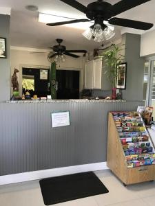 a counter in a kitchen with a ceiling fan at Apollo Inn - Cocoa in Cocoa