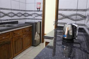 Kuchyň nebo kuchyňský kout v ubytování Grann Kaz Guest House