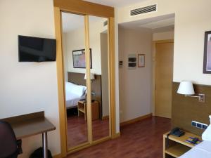 TV a/nebo společenská místnost v ubytování Hotel Palacio Congresos