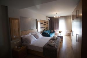Postel nebo postele na pokoji v ubytování Pallas Luxury Apartments