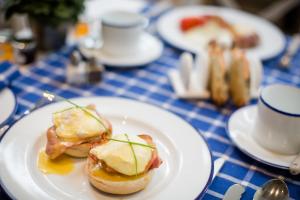 a plate of food on a blue and white table at Grays Boutique B&B in Bath