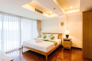 SeaRidge Hua Hin Resort & Poolvilla tesisinde bir odada yatak veya yataklar