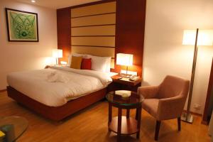 Voodi või voodid majutusasutuse Lemon Tree Hotel Shimona Chennai toas