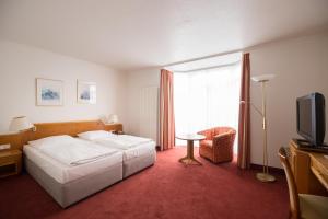 Ein Bett oder Betten in einem Zimmer der Unterkunft Boardinghouse am Wall