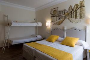 Postel nebo postele na pokoji v ubytování Palacio Valderrabanos