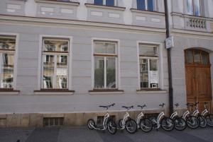 a row of bikes parked in front of a building at U koloběžky Apartment in Slavonice