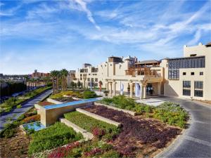 an aerial view of a building with a garden at Steigenberger Aqua Magic, All inclusive in Hurghada